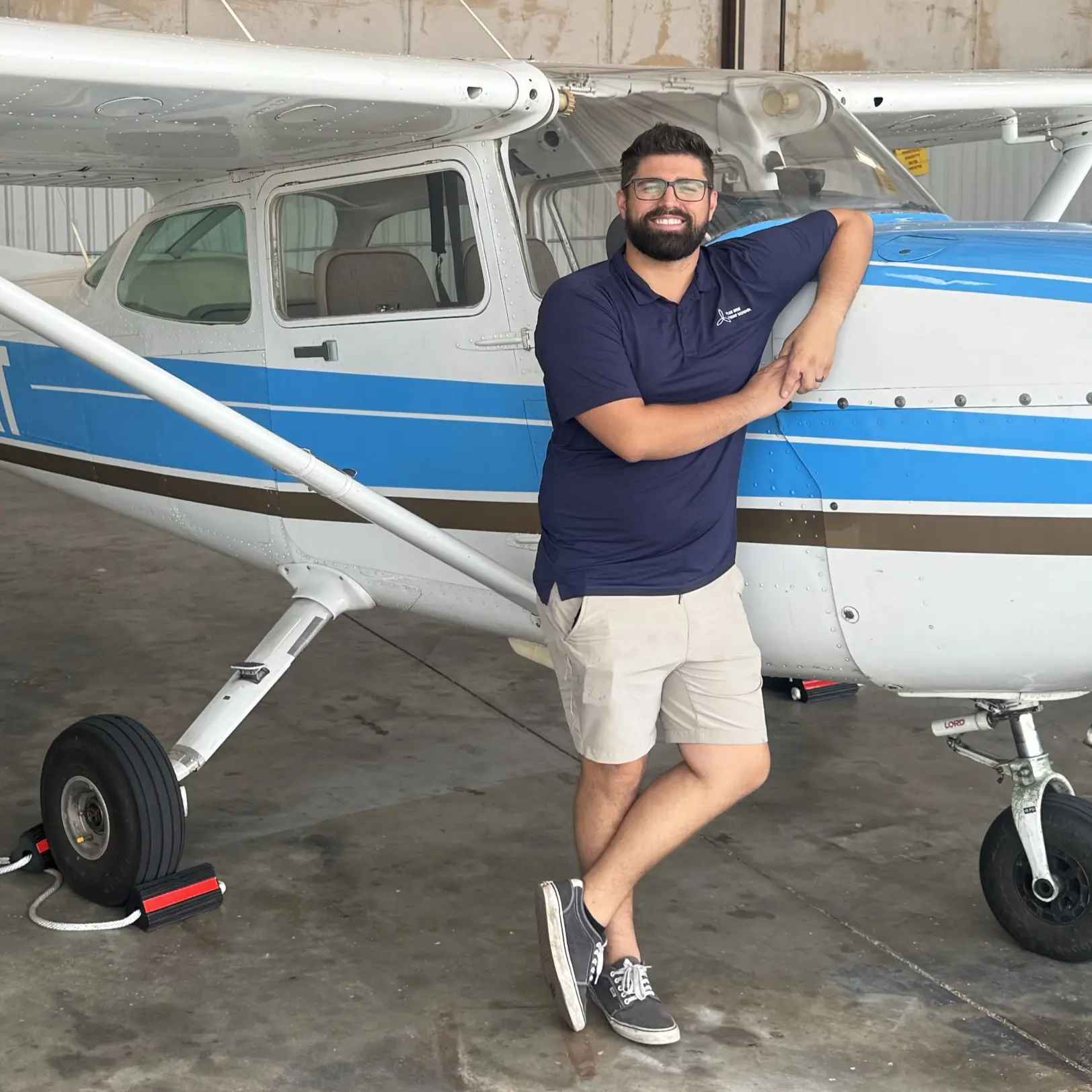 Anthony Balaity, Pilot Rise Dallas manager, standing beside a Cessna