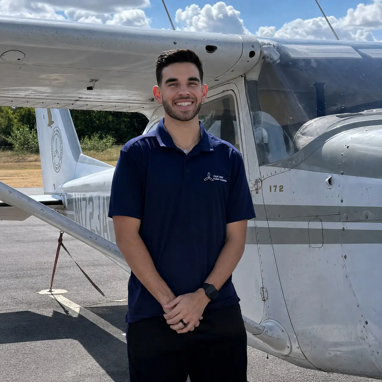 Flight instructor jobs Dallas Fort Worth team member Jaxon Craig standing beside a Cessna at Pilot Rise