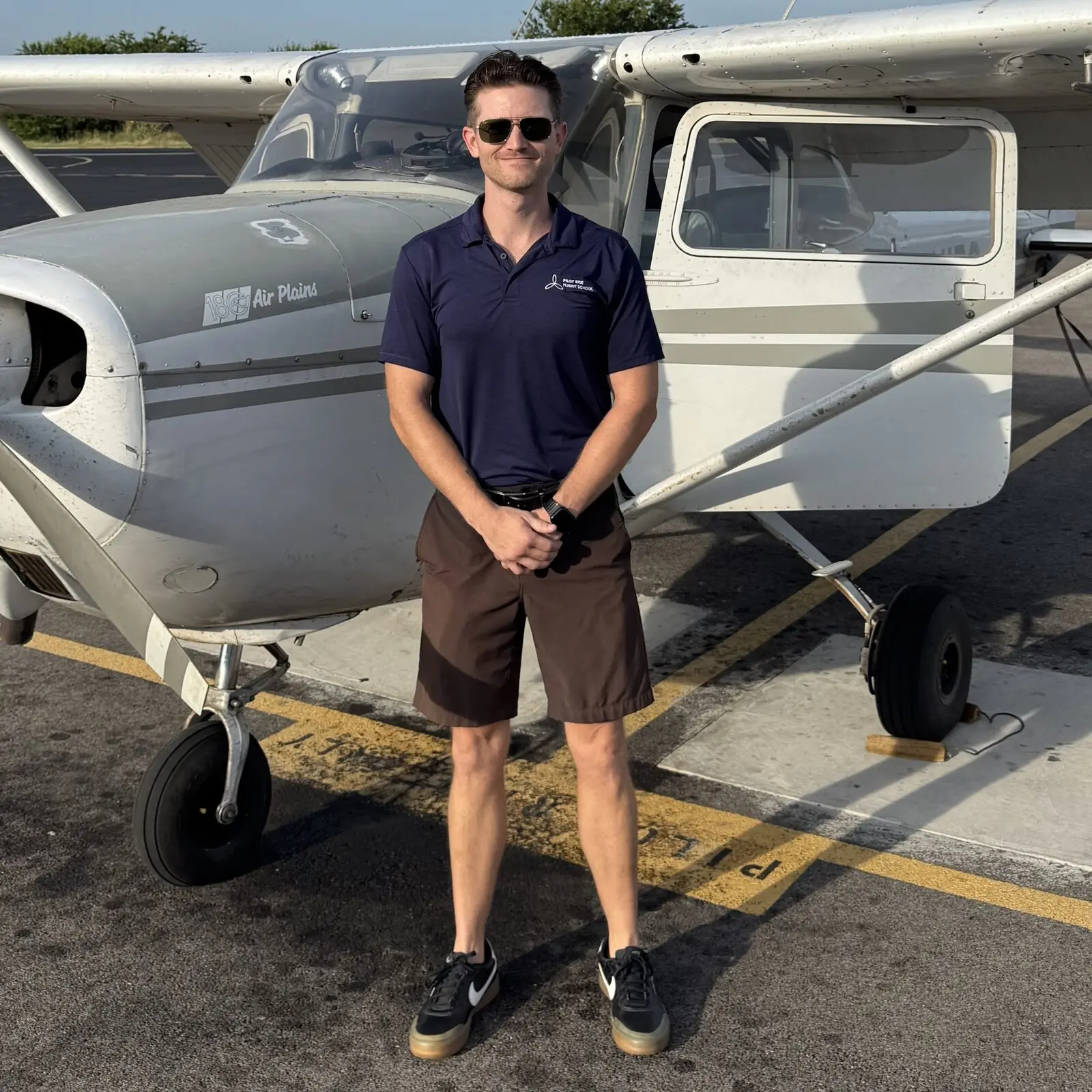 Jordan Connors, flight instructor at Pilot Rise Fort Worth, standing by a Cessna