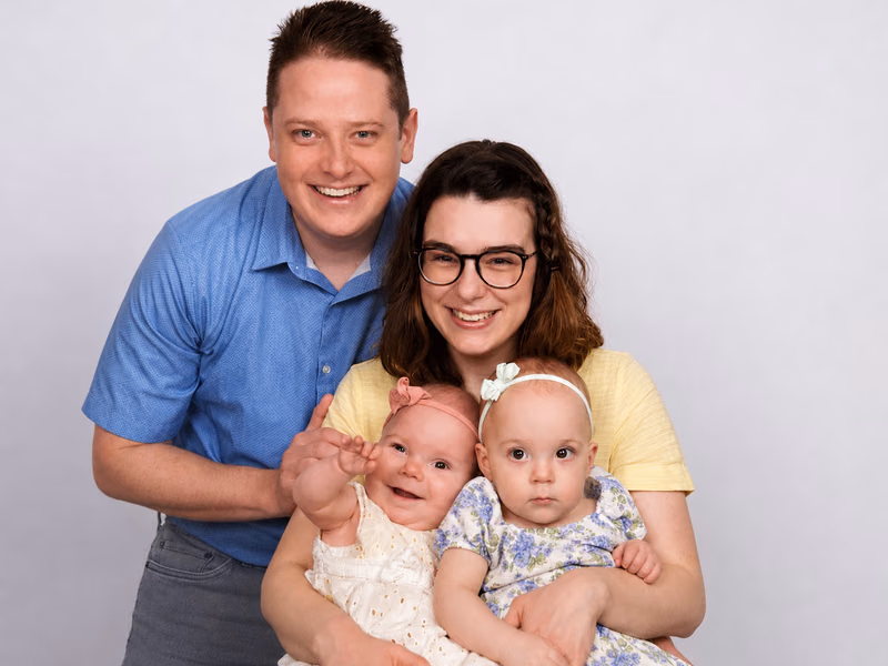 Michael and his wife with their twin daughters