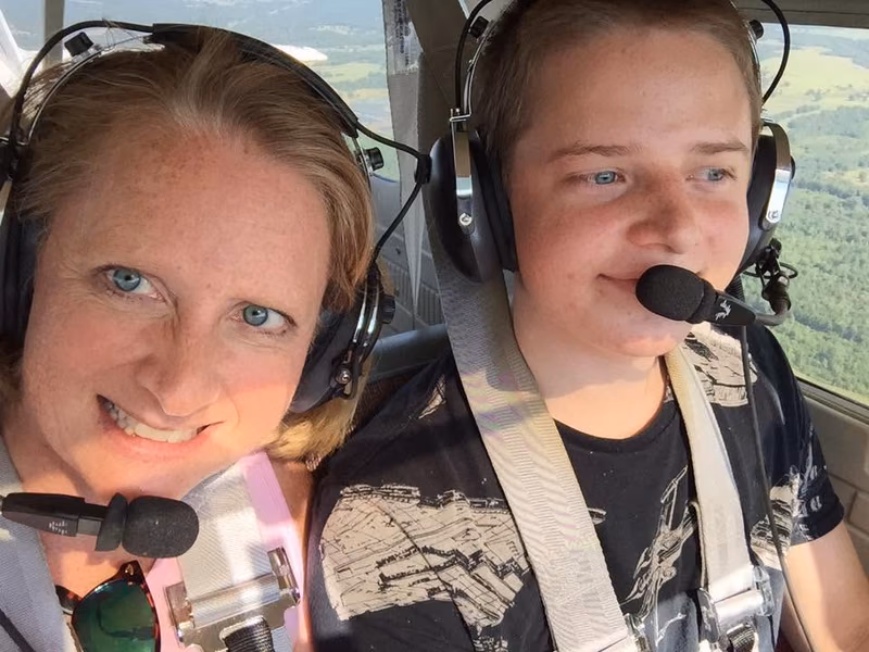 Michael Forseth flying with his mother after earning his private pilot certificate at 17