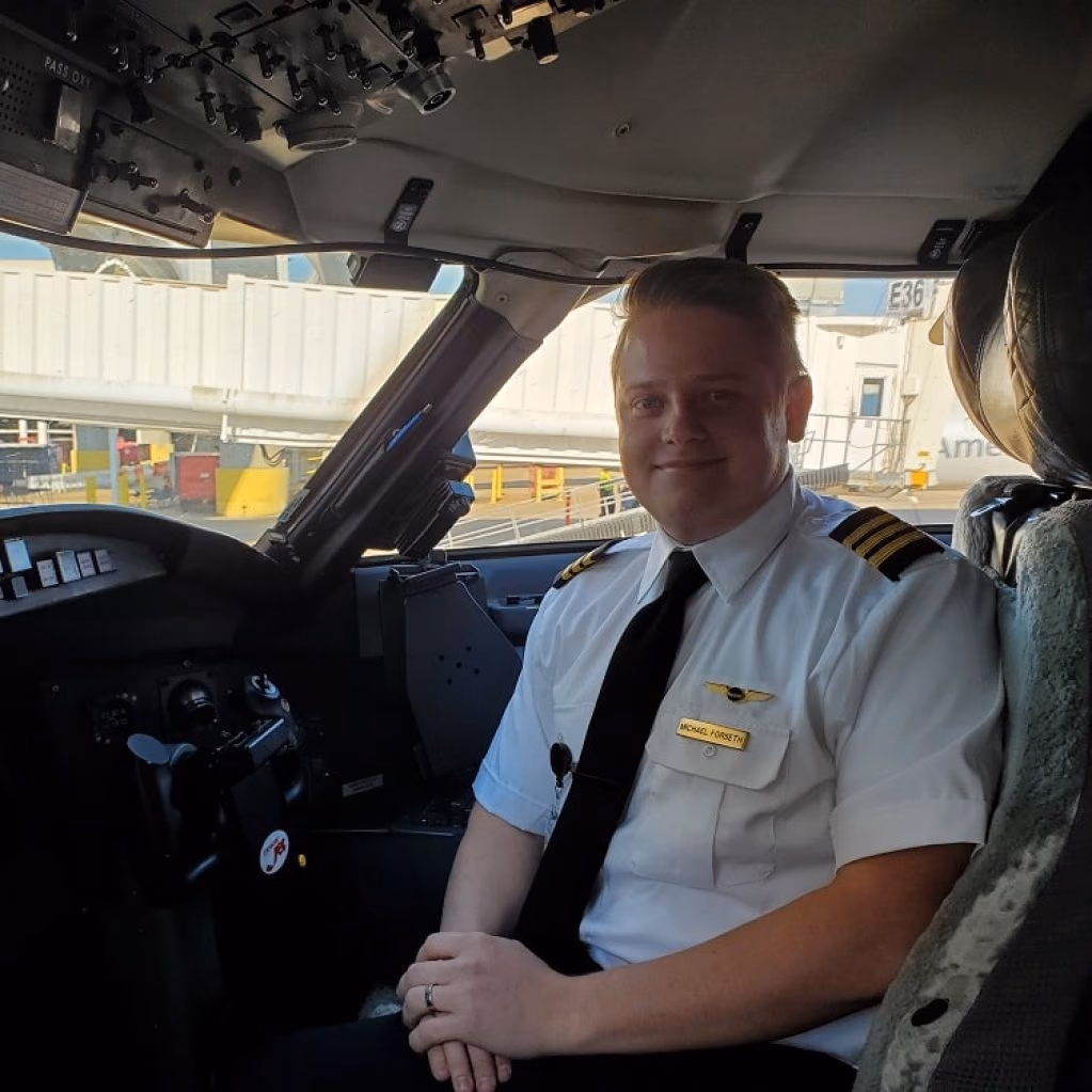Michael Forseth, founder of Pilot Rise, in the cockpit of a CRJ-700