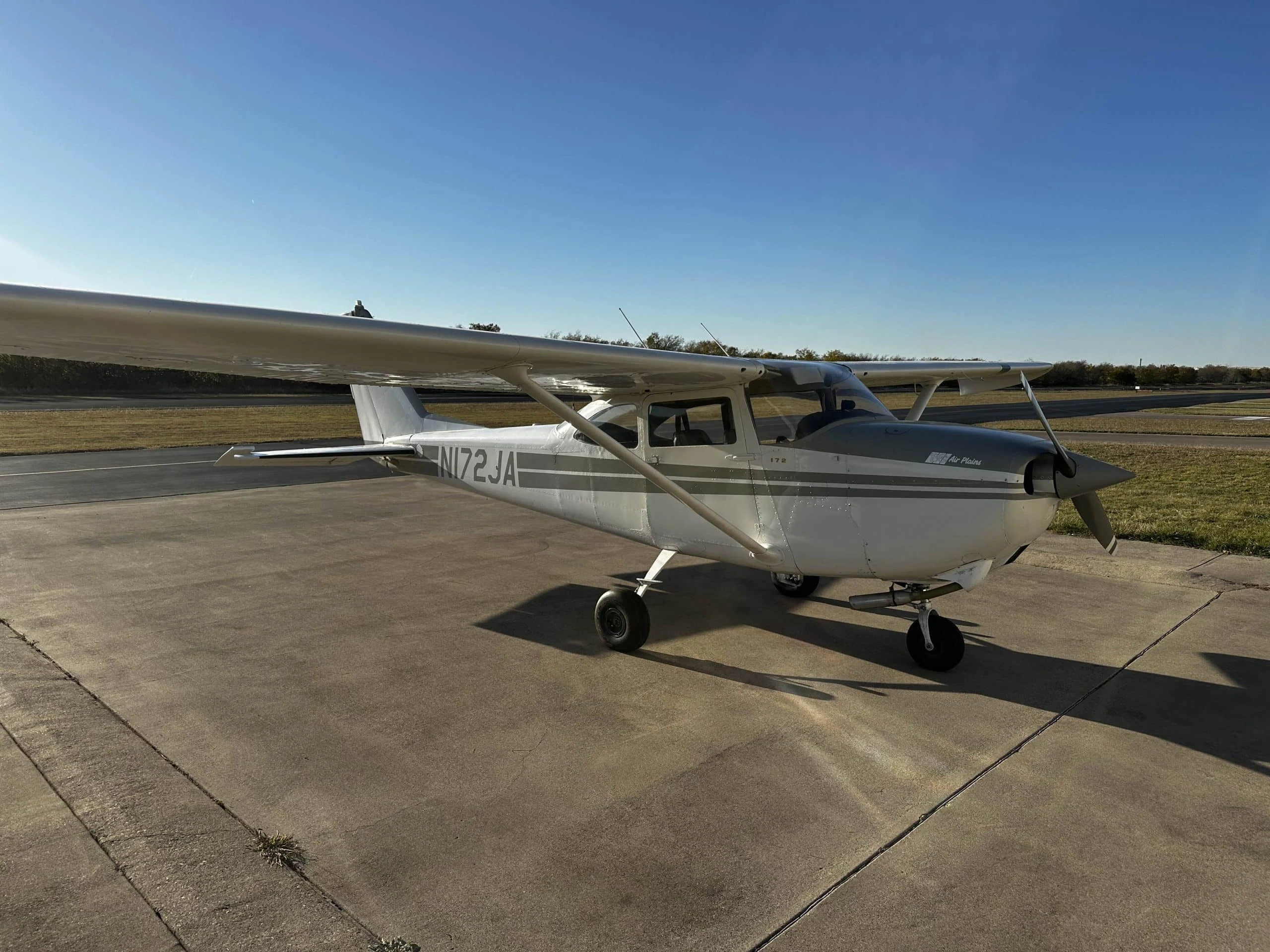 Pilot Rise Cessna 172G N172JA parked outside