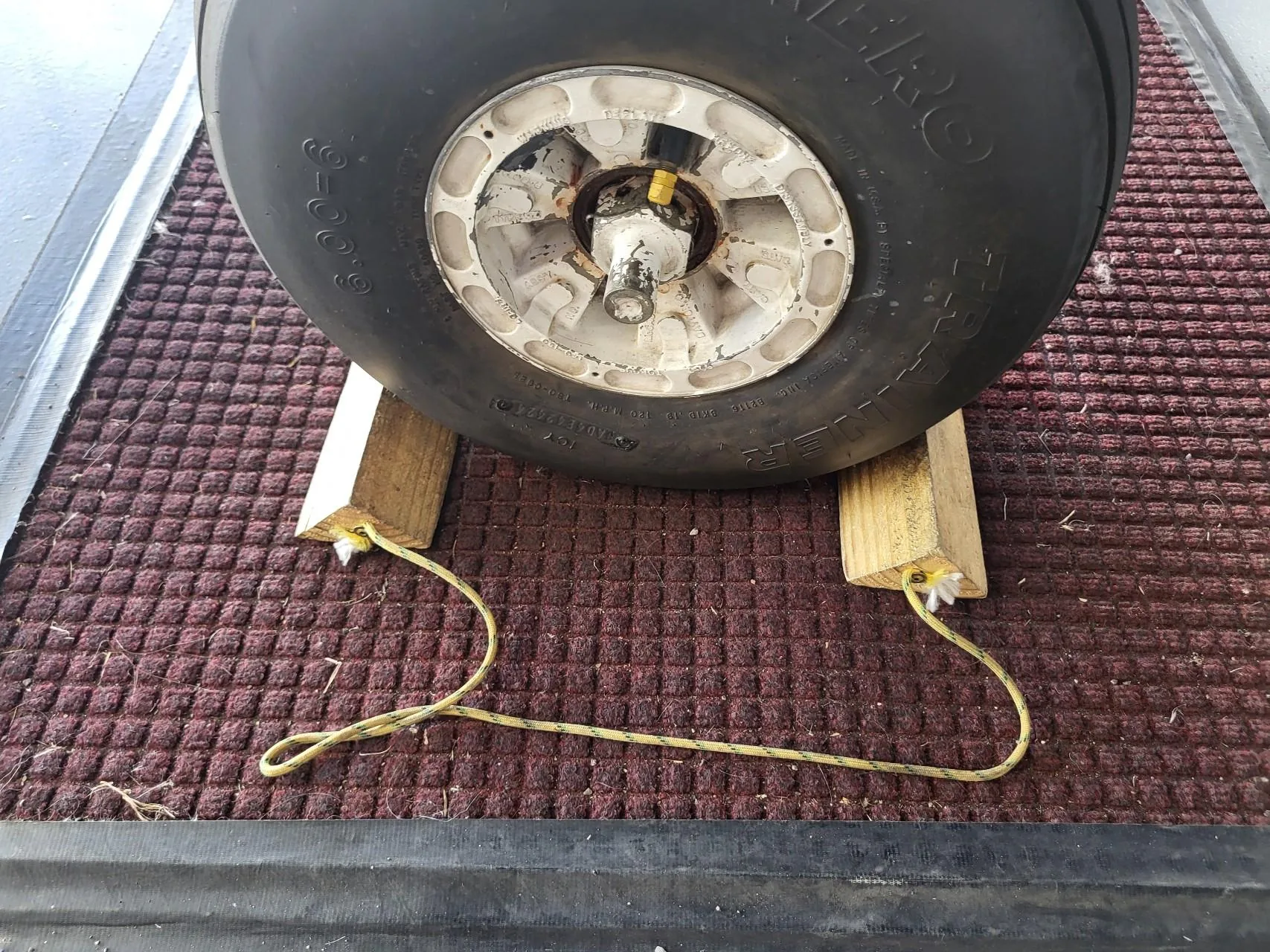 Wheel chocks around an aircraft tire