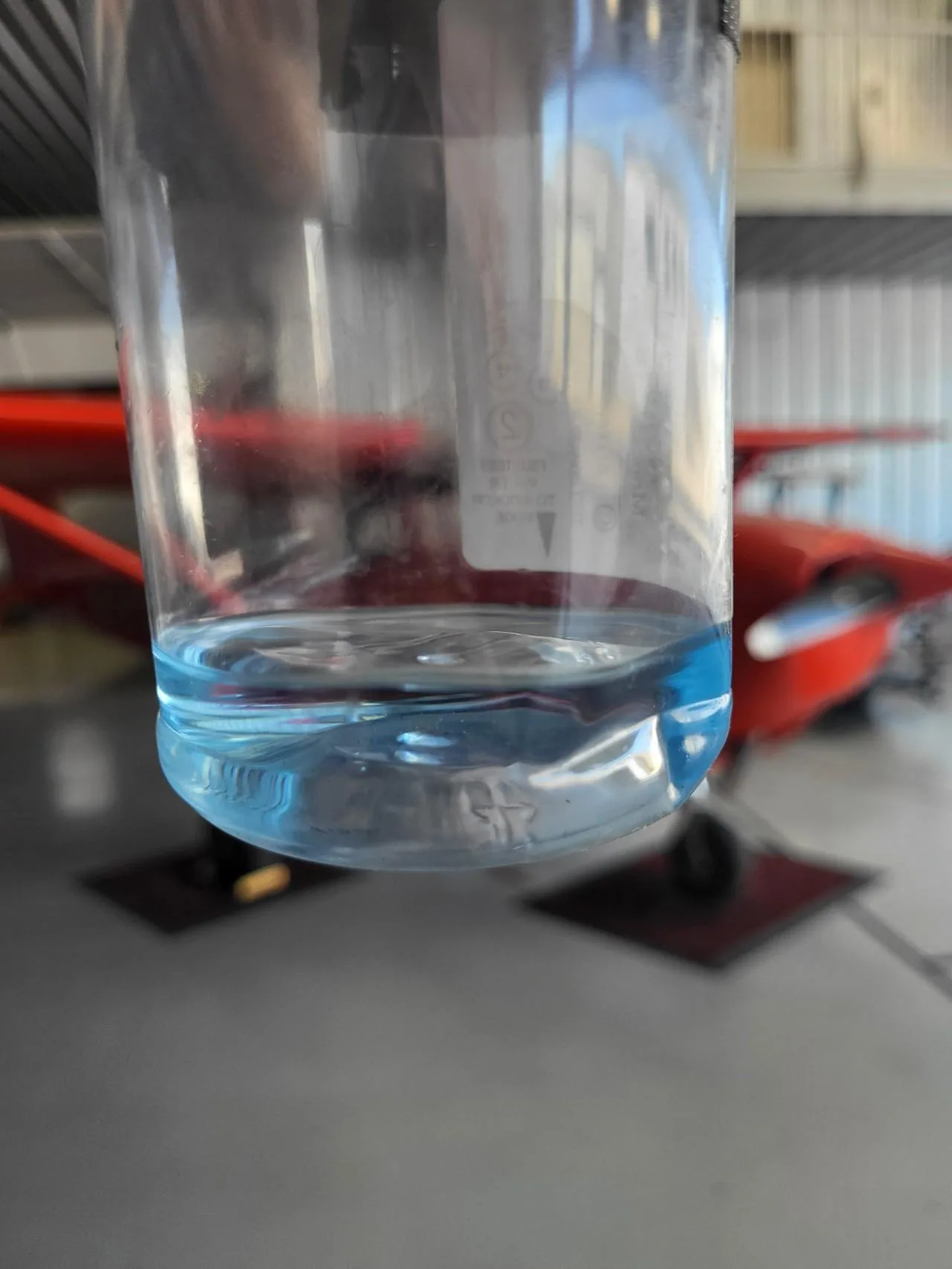 Blue uncontaminated aviation fuel sample