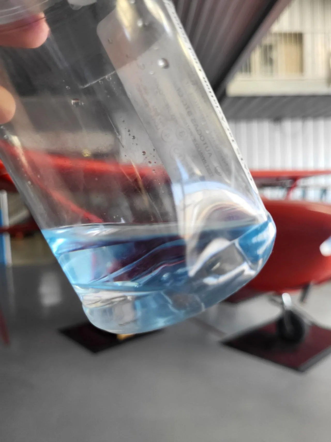 Fuel sample with water settled at the bottom