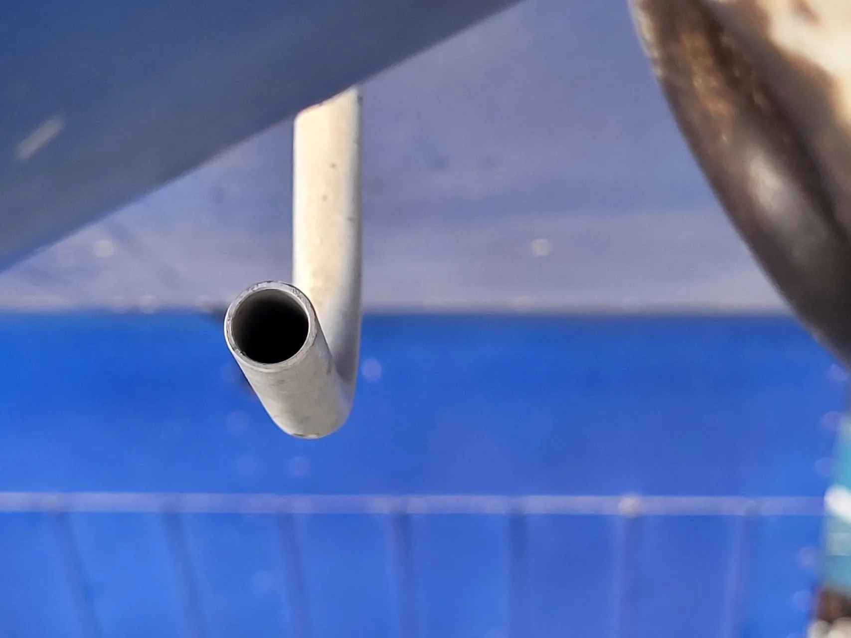 View into the opening of a fuel tank vent