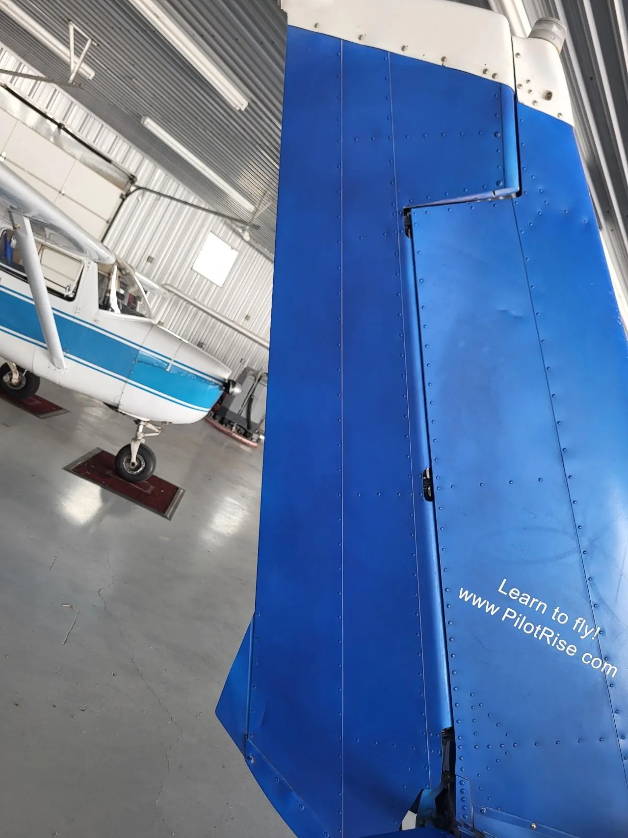 Ground-adjustable rudder trim tab