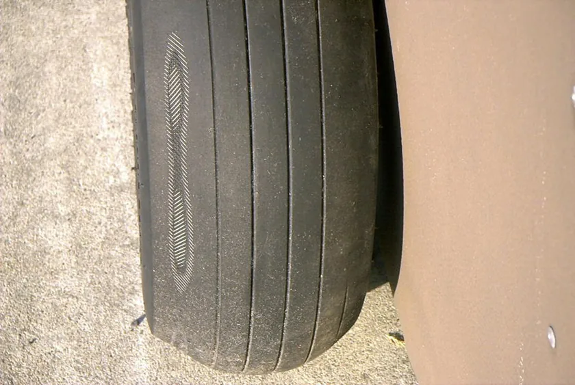 Aircraft tire worn through to exposed fabric