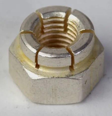 Aircraft lock nut with threads showing